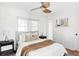 Bright bedroom with a ceiling fan, neutral walls, window with blinds and carpet floors at 2655 S Humboldt St, Denver, CO 80210