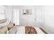Bright bedroom with neutral walls, a light-colored carpet, and a door at 2655 S Humboldt St, Denver, CO 80210