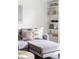 Cozy living room with a plush gray sofa, decorative pillows, and stylish built-in shelving at 2655 S Humboldt St, Denver, CO 80210