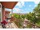 Outdoor balcony with grill, chairs, and a view of the street at 2100 N Humboldt St # 302, Denver, CO 80205