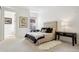 Bright bedroom with a tufted headboard, plush bedding, and ample natural light at 2100 N Humboldt St # 302, Denver, CO 80205