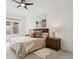 Bedroom featuring natural light, ceiling fan, decorative rug and natural-tone night stands at 2100 N Humboldt St # 302, Denver, CO 80205