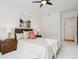 Bedroom featuring ceiling fan, decorative rug, neutral color palette, and double closet at 2100 N Humboldt St # 302, Denver, CO 80205