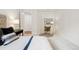 Serene bedroom featuring a plush bed, side tables, and carpet at 2100 N Humboldt St # 302, Denver, CO 80205