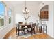 Dining room area with hardwood floors, chandelier, and breakfast bar at 2100 N Humboldt St # 302, Denver, CO 80205