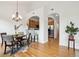 Dining area with chandelier, breakfast bar, and hardwood floors at 2100 N Humboldt St # 302, Denver, CO 80205