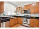 A well-maintained kitchen boasts granite countertops, stainless steel appliances, and ample cabinet space at 2100 N Humboldt St # 302, Denver, CO 80205