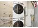 Laundry room featuring a stacked washer and dryer set at 2100 N Humboldt St # 302, Denver, CO 80205