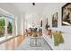 The open-concept living room offers balcony access and seamlessly connects to the dining area at 2100 N Humboldt St # 302, Denver, CO 80205