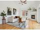 Inviting living room with fireplace, plush seating, and a large window for ample natural light at 2100 N Humboldt St # 302, Denver, CO 80205
