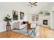 Cozy living room with hardwood floors, a fireplace, and large windows at 2100 N Humboldt St # 302, Denver, CO 80205