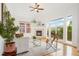 Bright living room featuring hardwood floors, a fireplace, and a sliding glass door to a balcony at 2100 N Humboldt St # 302, Denver, CO 80205