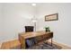 Cozy office space with sleek wooden desk, comfortable chair and soft lighting at 2100 N Humboldt St # 302, Denver, CO 80205