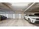 Parking garage featuring reserved parking spots with storage lockers for each unit at 2100 N Humboldt St # 302, Denver, CO 80205