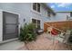 Cozy fenced back patio with brickwork and outdoor furniture, perfect for relaxing or entertaining at 6937 S Knolls Way, Centennial, CO 80122