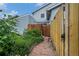 Home exterior featuring a backyard gate, patio, and green space at 6937 S Knolls Way, Centennial, CO 80122