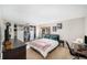 Inviting bedroom features closet organizers, a cozy bed, and a well-lit workspace at 6937 S Knolls Way, Centennial, CO 80122