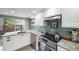 Beautiful kitchen features stainless steel appliances and granite countertops at 6937 S Knolls Way, Centennial, CO 80122