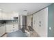 This modern kitchen showcases a stainless steel refrigerator and ample cabinet space at 6937 S Knolls Way, Centennial, CO 80122