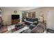 Inviting living room features a cozy fireplace, a large window, and comfortable seating at 6937 S Knolls Way, Centennial, CO 80122