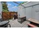 Outdoor patio with grill, table, seating, and string lights at 6937 S Knolls Way, Centennial, CO 80122