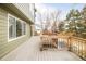 Large backyard deck perfect for entertaining with views of the lawn and fire pit area at 10063 Silver Maple Rd, Highlands Ranch, CO 80129