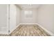 Basement bedroom featuring plank flooring, neutral walls, and natural light at 10063 Silver Maple Rd, Highlands Ranch, CO 80129