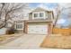 Charming two-story home featuring a brick-accented garage and well-maintained front yard at 10063 Silver Maple Rd, Highlands Ranch, CO 80129