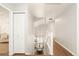 Inviting hallway that flows to upstairs and overlooks dining room with tons of light at 10063 Silver Maple Rd, Highlands Ranch, CO 80129