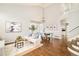 Bright and airy living room with hardwood floors, high ceilings and modern furnishings at 10063 Silver Maple Rd, Highlands Ranch, CO 80129