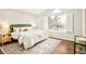 Serene main bedroom featuring vaulted ceiling and a bright window dressed with shutters at 10063 Silver Maple Rd, Highlands Ranch, CO 80129