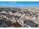 Aerial shot showing the home's location within a thriving residential community and lake at 6733 S Waterloo Ct, Aurora, CO 80016