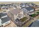 Aerial view showcasing a home's backyard with patio, grilling area, and fenced yard at 6733 S Waterloo Ct, Aurora, CO 80016