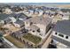 Aerial view of a well-maintained backyard with a patio, fire pit, and landscaped area at 6733 S Waterloo Ct, Aurora, CO 80016