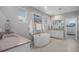 Luxurious bathroom with standalone tub, double vanities, and beachy decor at 6733 S Waterloo Ct, Aurora, CO 80016