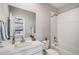 Bright bathroom features a tub with white subway tile surround and a quartz vanity at 6733 S Waterloo Ct, Aurora, CO 80016