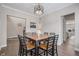 Elegant dining room featuring a wooden table with stylish chairs at 6733 S Waterloo Ct, Aurora, CO 80016