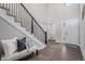 Inviting foyer featuring a staircase with iron railings and stylish decor at 6733 S Waterloo Ct, Aurora, CO 80016
