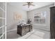Bright home office with a ceiling fan, natural light, and comfortable carpet at 6733 S Waterloo Ct, Aurora, CO 80016