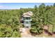 Unique home surrounded by lush trees offering privacy and a beautiful setting at 6681 Flintwood Rd, Parker, CO 80138