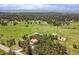 Aerial view of a home nestled among trees, showcasing the surrounding landscape at 6681 Flintwood Rd, Parker, CO 80138