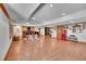The large basement features a seating area, wood floors, and wood details throughout at 6681 Flintwood Rd, Parker, CO 80138