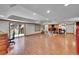 Spacious finished basement with wood-look floors, a wet bar, a fireplace, and ample room to entertain at 6681 Flintwood Rd, Parker, CO 80138