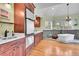 Modern bathroom with sleek fixtures, ample counterspace, a soaking tub, and a separate shower at 6681 Flintwood Rd, Parker, CO 80138