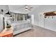 Comfortable bedroom with natural light and plush carpet at 6681 Flintwood Rd, Parker, CO 80138