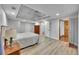 Bright bedroom showcasing wood floors, tin-look ceilings, and ample closet space at 6681 Flintwood Rd, Parker, CO 80138
