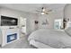 Well-lit primary bedroom with a fireplace and views of the en suite bathroom at 6681 Flintwood Rd, Parker, CO 80138