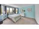 Cozy bedroom features light blue walls and large windows at 6681 Flintwood Rd, Parker, CO 80138