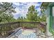 View from the deck, surrounded by trees and ample seating space at 6681 Flintwood Rd, Parker, CO 80138