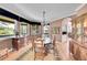 Cozy dining room with hardwood floors, crown molding, and views of the green outdoors at 6681 Flintwood Rd, Parker, CO 80138